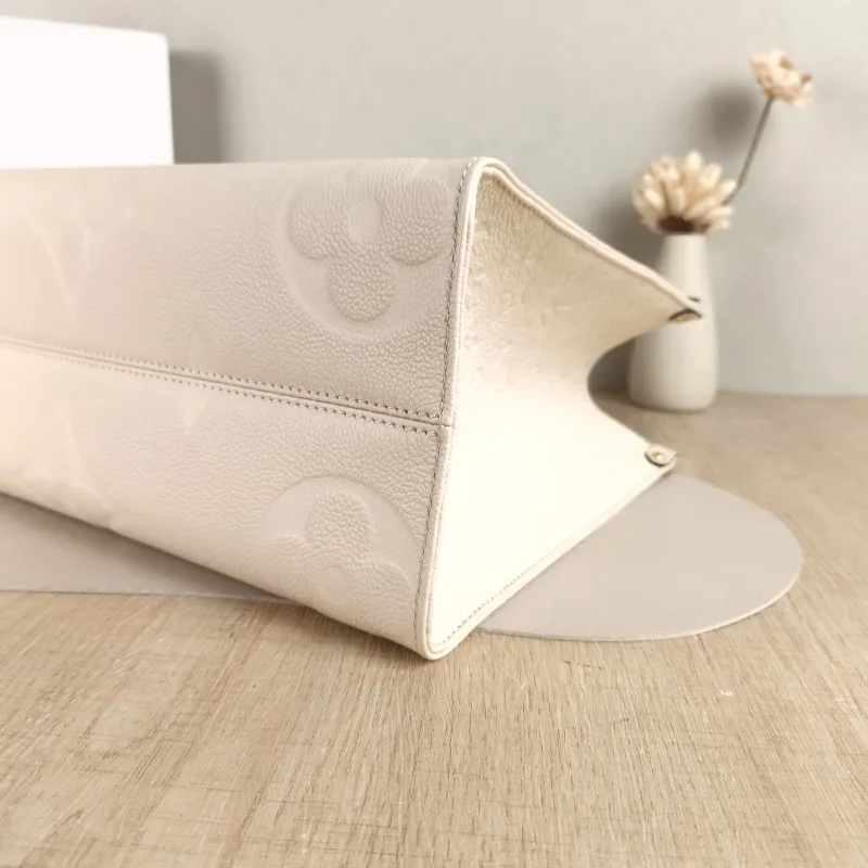 Louis Vuitton Shoulder Bag Onthego Medium White Monogram Empreinte Embossed Calfskin Medium 35 × 14 × 27 cm — detail view 1 of 10