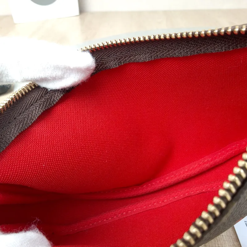 Louis Vuitton Clutch Mini Pochette Accessoires Monogram PVC Mini 15.5 × 4 × 10.5 cm — detail view 8 of 9