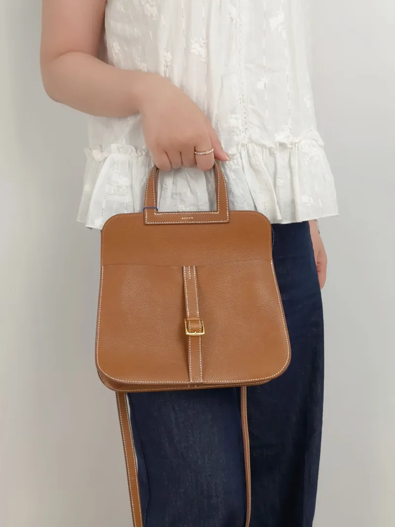 Hermès Shoulder Bag Halzan 25 Brown Saddle Leather Small25 × 8 × 17 cm — on-model view 2 of 3