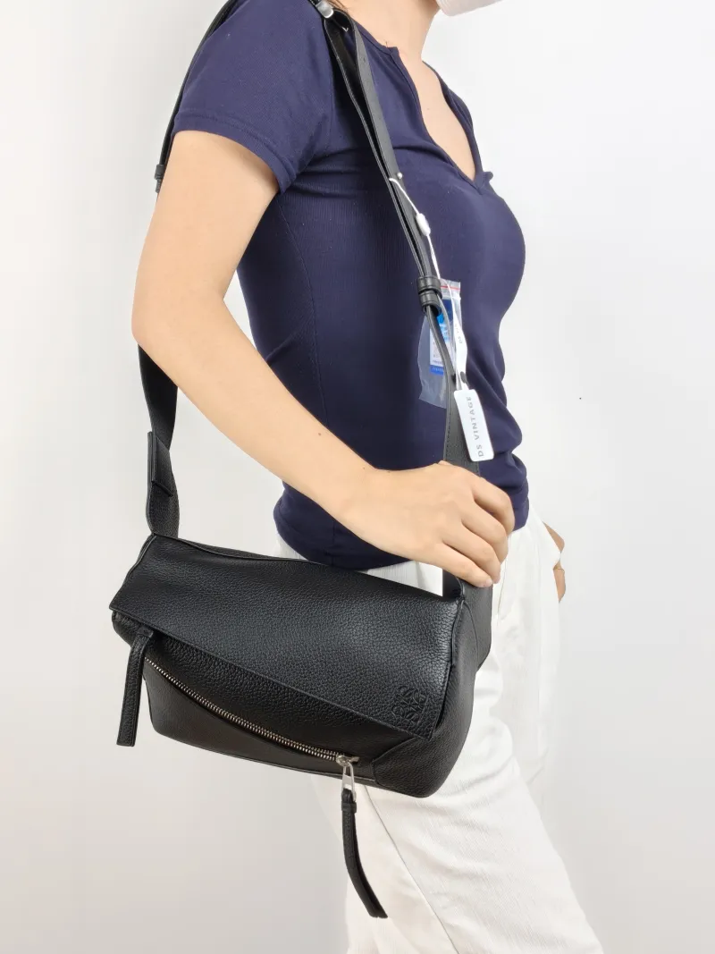 LOEWE Belt Bag Puzzle Belt Bag Black CC alfskin Small 24 × 10.5 × 16 cm — on-model view 1 of 2