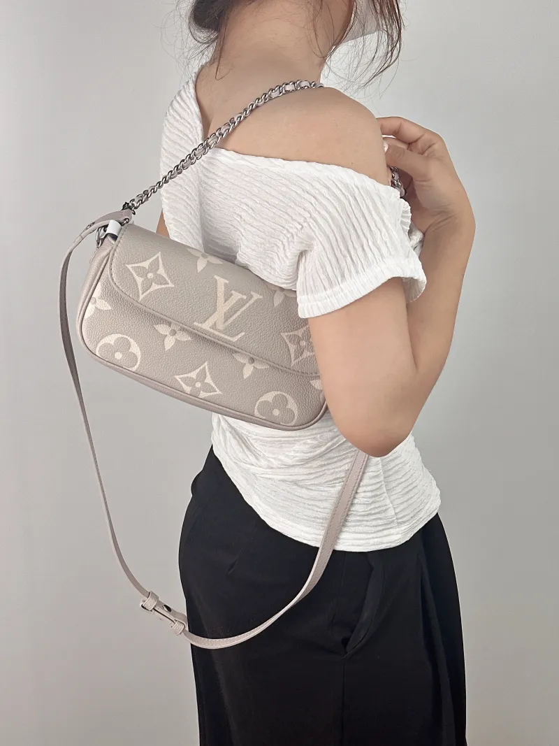 Louis Vuitton Crossbody Bag IVY Grey · White Monogram Empreinte Embossed Calfskin Small 23.5 × 4.3 × 12 cm — on-model view 1 of 2