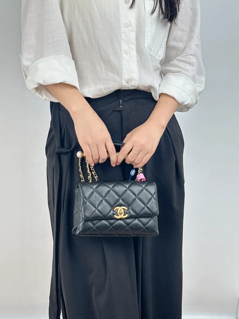 Chanel Crossbody Bag Pearl Black Lambskin Mini 19 × 7 × 13 cm — on-model view 1 of 2