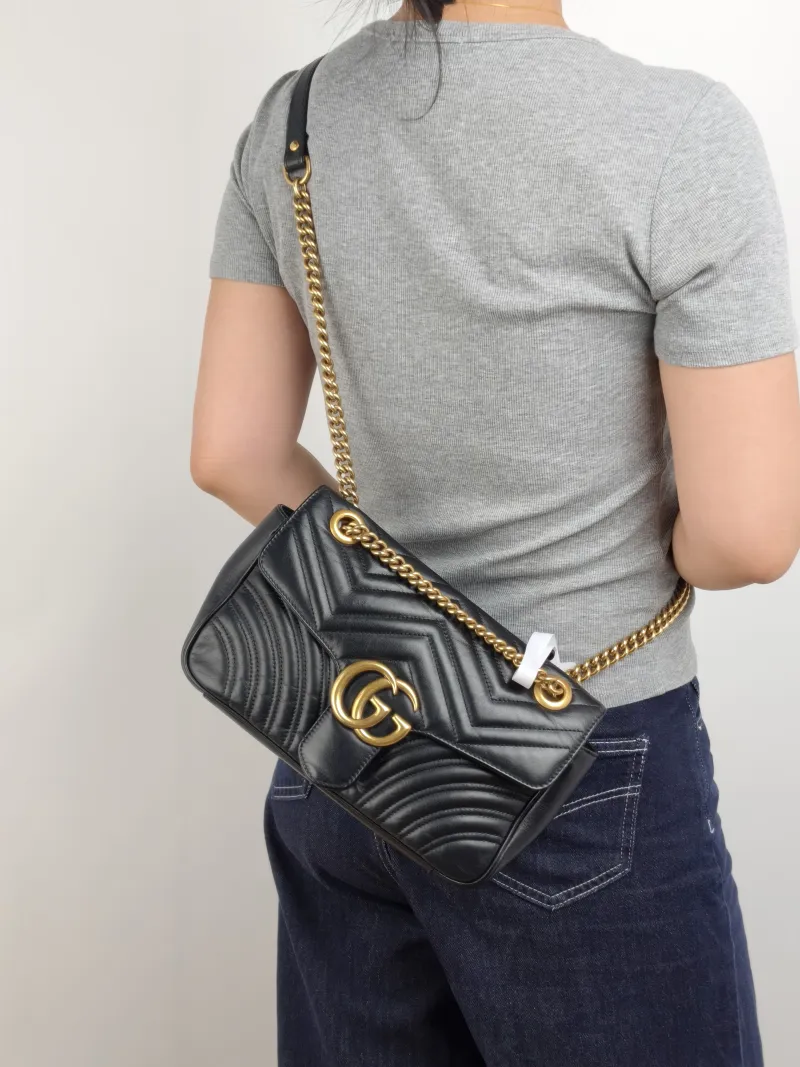 GUCCI Crossbody Bag GG Marmont Medium Marmont 26 Black CC alfskin Medium 26 × 7 × 15 cm — on-model view 1 of 2