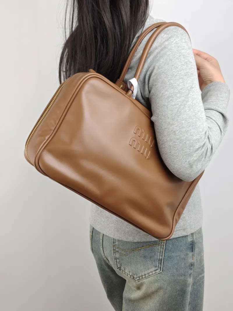 Miumiu Top Handle Bag Beau CC alfskin Large 34 × 10 × 23 cm — on-model view 2 of 2