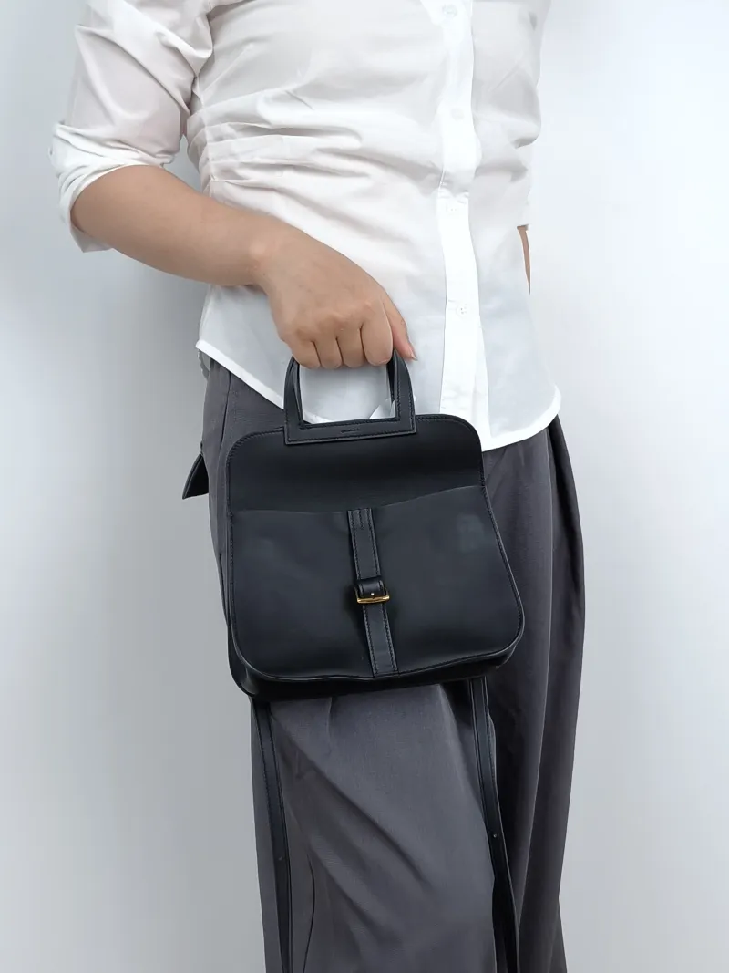 Hermès Crossbody Bag Halzan Black Swift Calfskinmini22 × 6.5 × 15 cm — on-model view 1 of 2