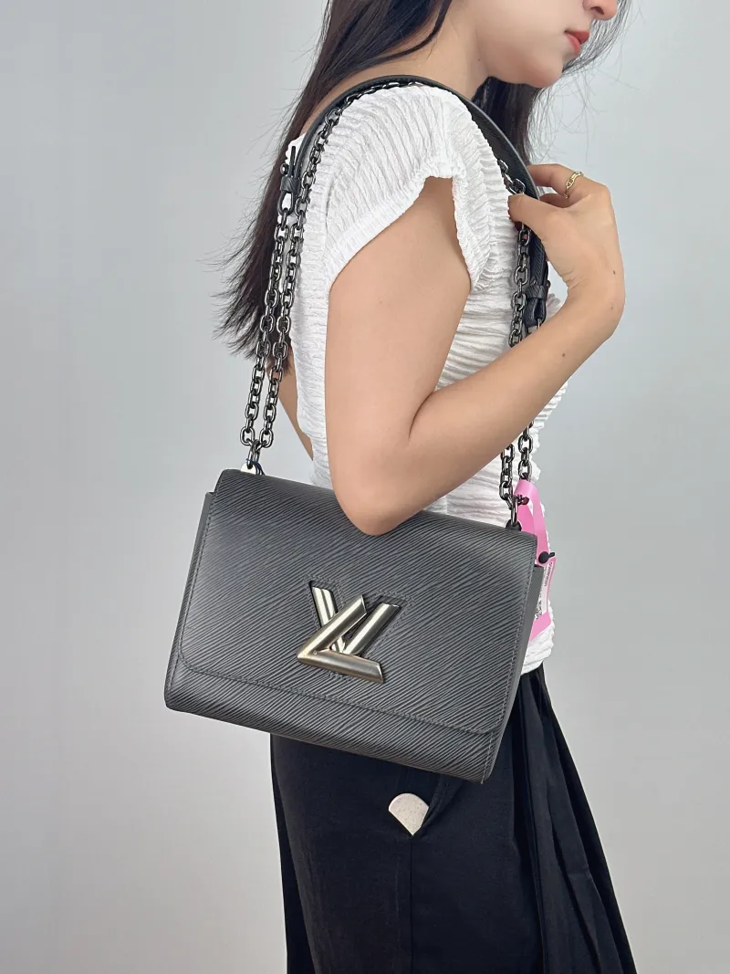 Louis Vuitton Crossbody Bag Twist Grey Calfskin Medium 23 × 9.5 × 17 cm — on-model view 1 of 2