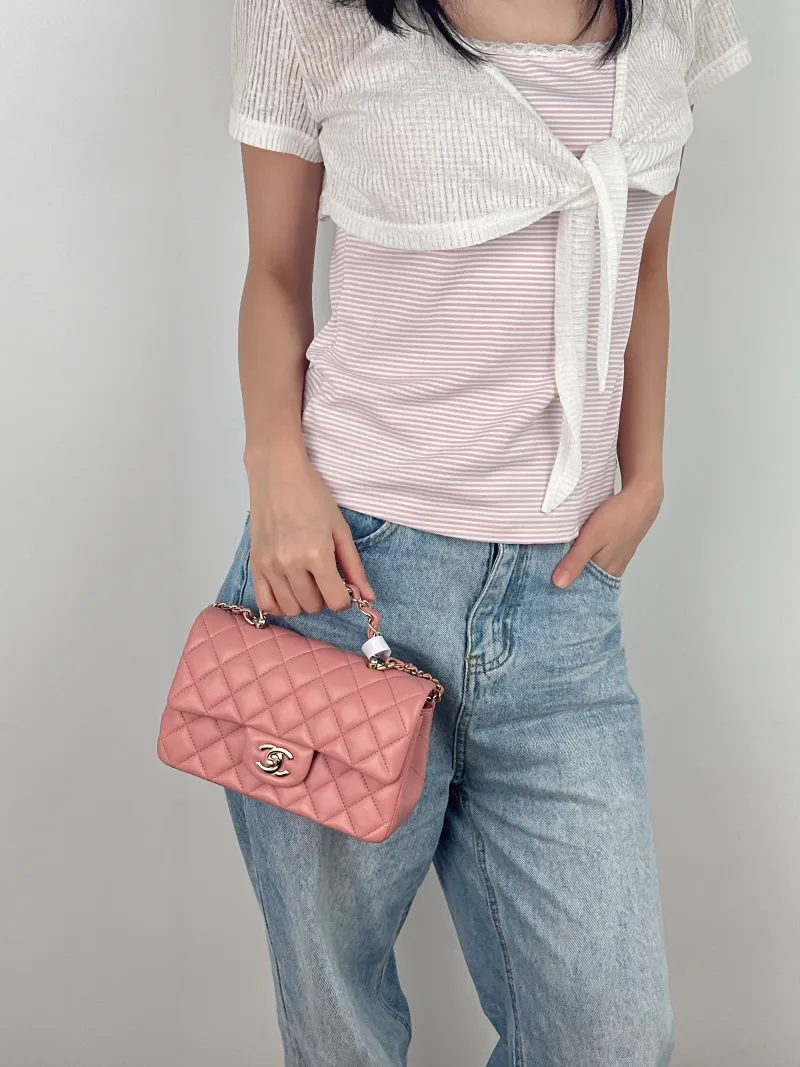 Chanel Crossbody Bag23k logo mini Pink Lambskin mini20 × 6 × 12 cm — on-model view 1 of 3