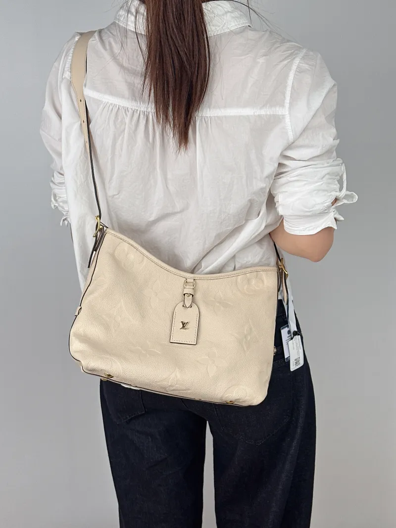 Louis Vuitton Crossbody Bag Carryall White Calfskin Small29.5 × 12 × 24 cm — on-model view 1 of 2