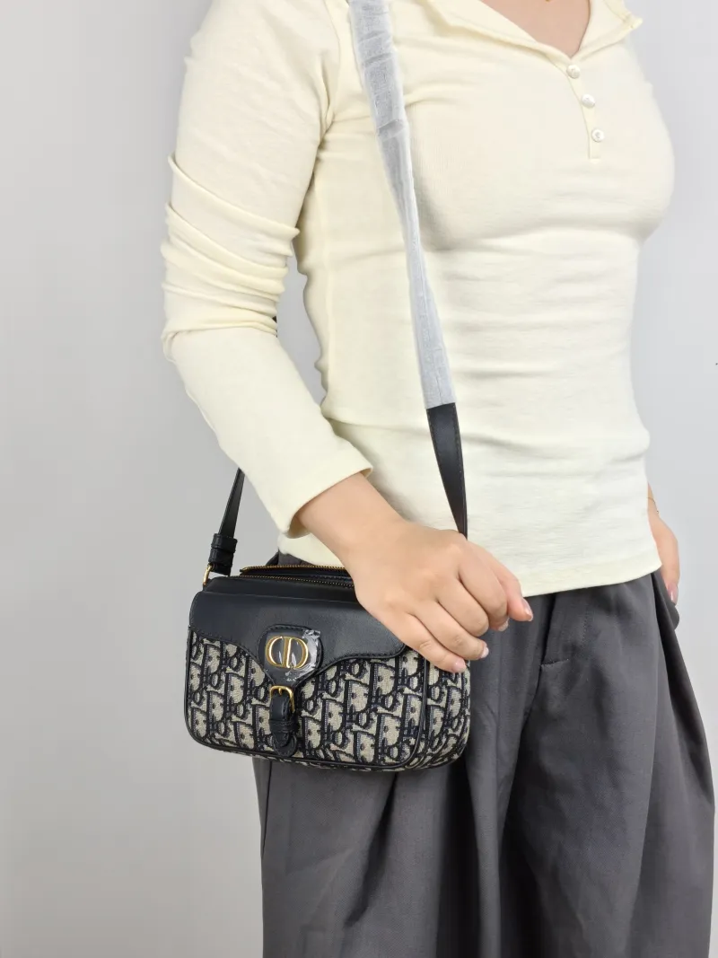 DIOR Crossbody Bag 30Montaigne Blue Canvas Small 19.5 × 6.5 × 11 cm — on-model view 1 of 2