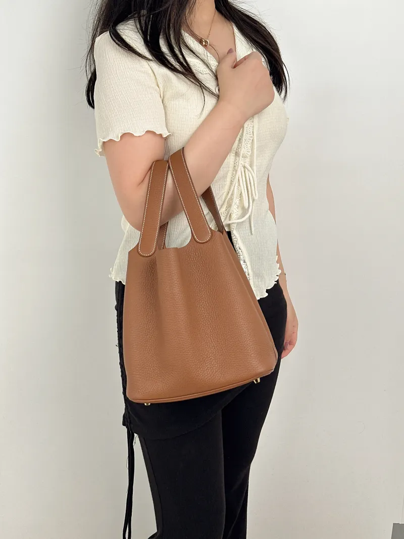 Hermès Top Handle Bag Picotin Lock 22 22 Clemence Taurillon TC Calfskin Medium22 × 18 × 21 cm — on-model view 2 of 2