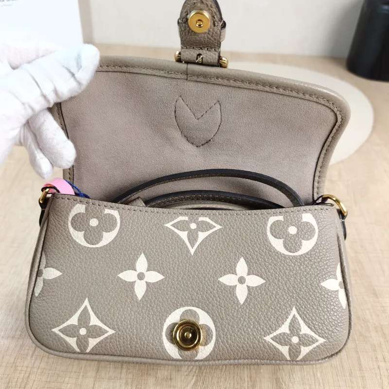 Louis Vuitton Crossbody Bag Diane Baguette Bag Empreinte Embossed Calfskin nano 19 × 6 × 10.5 cm — detail view 6 of 12