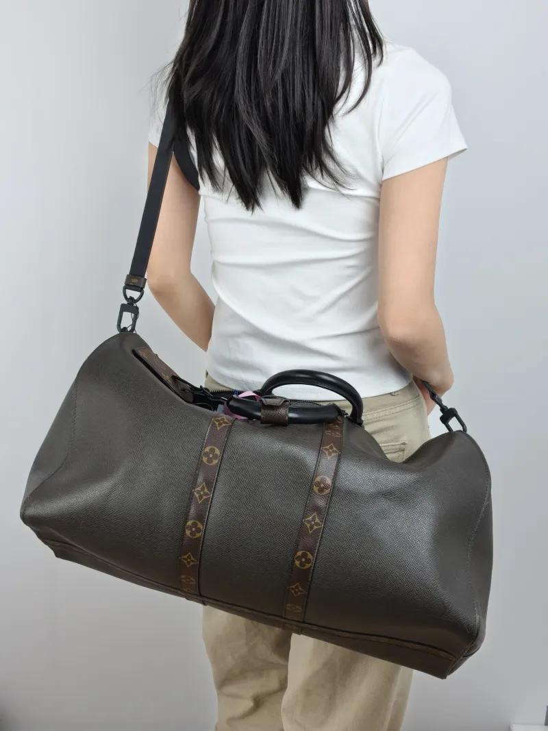 Louis Vuitton Top Handle Bag Keepall 50 Shoulder Strap Edition Green Calfskin One Size 50 × 23 × 29 cm — on-model view 1 of 3