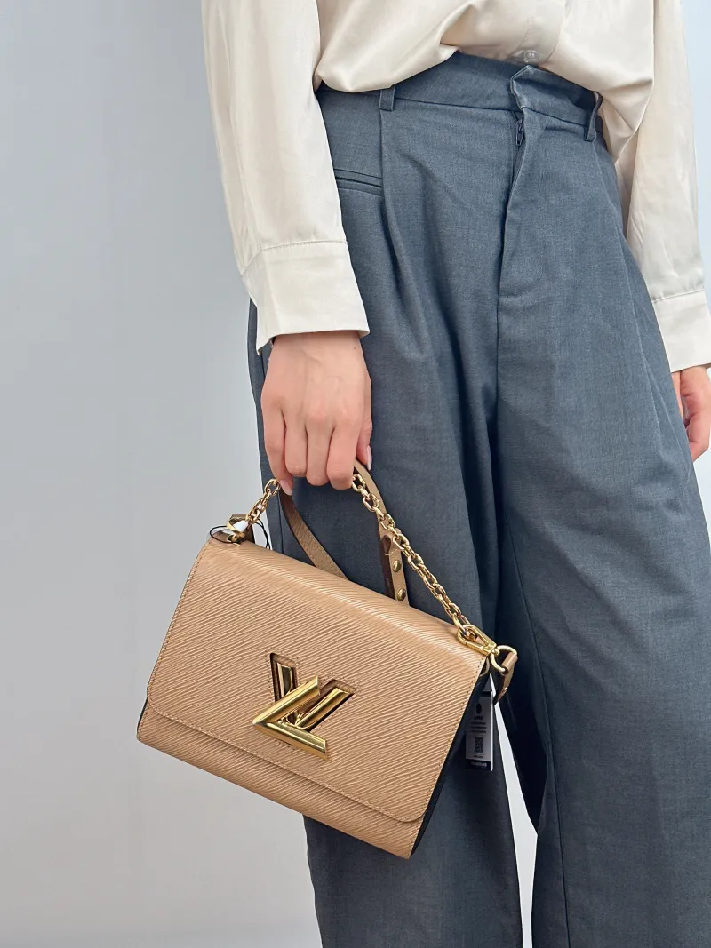 Louis Vuitton Crossbody Bag Twist Taupe Epi Embossed Calfskin Medium 23 × 9.5 × 17 cm — on-model view 2 of 2