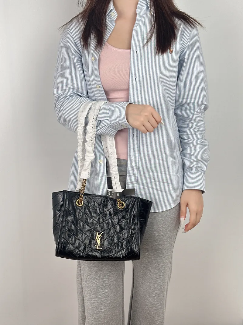 SAINT LAURENT Shoulder Bag Niki Shopping Tote Black Calfskin Small 25 × 10 × 19 cm — on-model view 1 of 2
