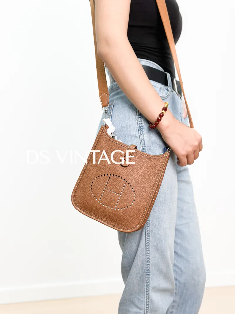 Hermès Crossbody Bag Evelyne Mini 16 Mini 16 Clemence Taurillon TC Calfskinmini17 × 5.5 × 18 cm — on-model view 1 of 3