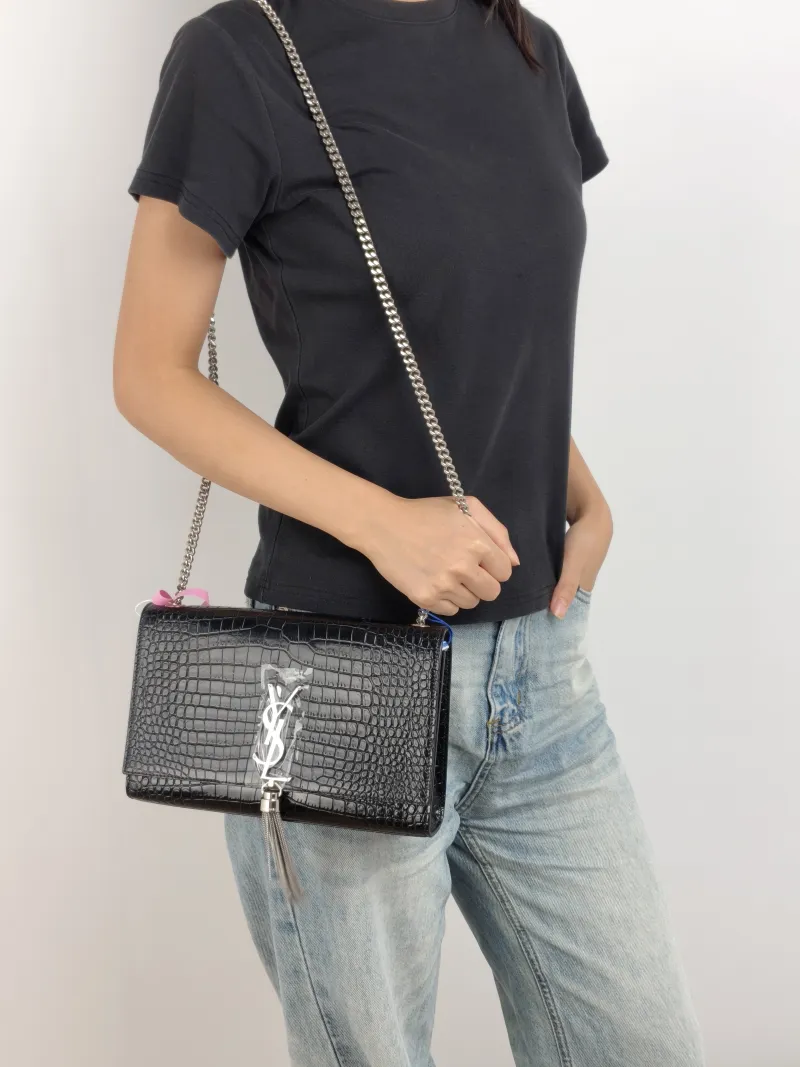 SAINT LAURENT Crossbody Bag KATE Edition Black Calfskin Medium 24 × 5.5 × 14.5 cm — on-model view 1 of 2