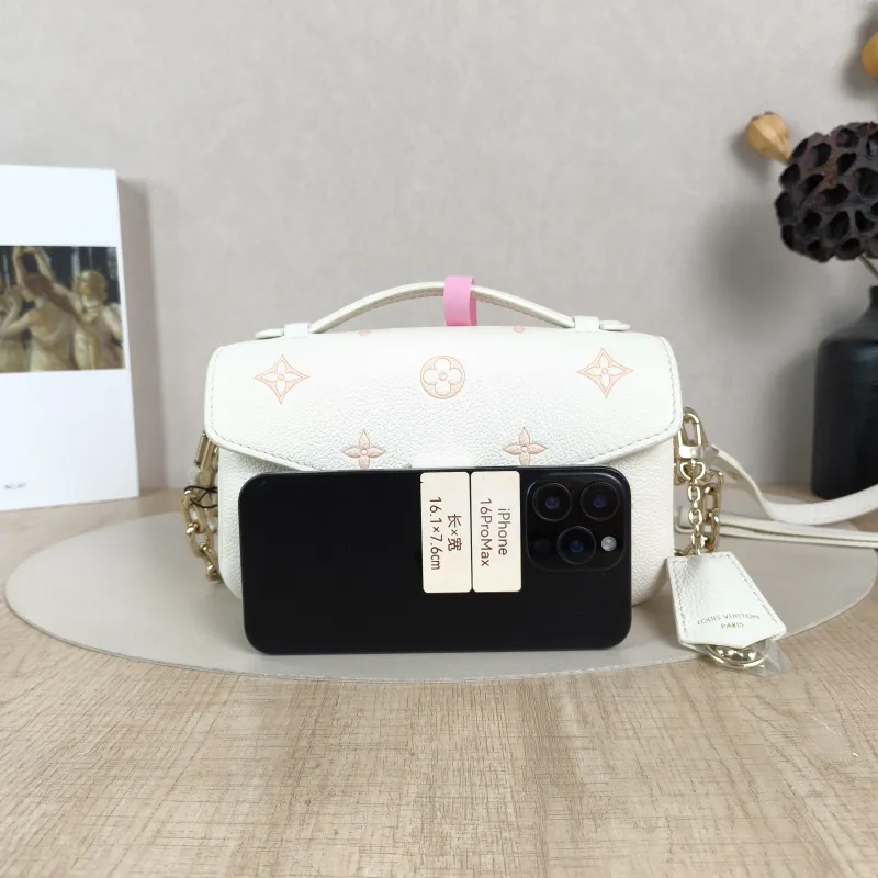 Louis Vuitton Crossbody Bag Pochette Métis East West White · Pink Monogram Empreinte Embossed Calfskin Small21.5 × 6 × 13.5 cm — cover view 2 of 5