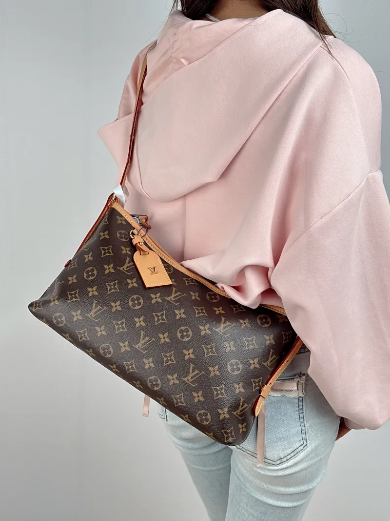 Louis Vuitton Shoulder Bag Carryall East West Monogram PVC One Size 36 × 10 × 19 cm — on-model view 2 of 3
