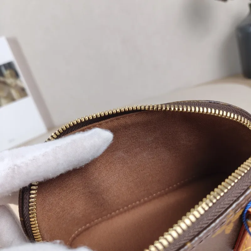 Louis Vuitton Crossbody Bag Alma Nano Monogram PVC nano 18 × 8 × 12 cm — detail view 1 of 12