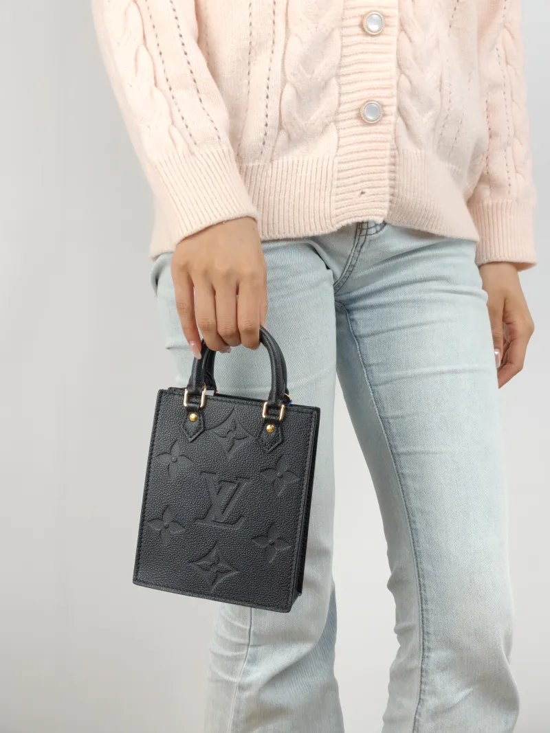 Louis Vuitton Crossbody Bag PETIT SAC PLAT Mini Black Calfskin Mini 14 × 5 × 17 cm — on-model view 2 of 2