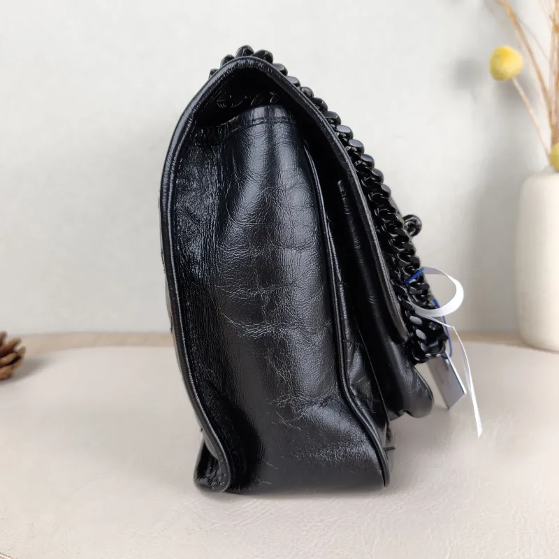 SAINT LAURENT Crossbody Bag Niki Black Waxed Leather Calfskin Medium 28 × 8.5 × 20 cm — detail view 1 of 14