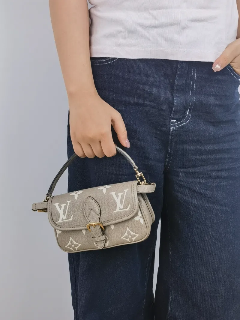 Louis Vuitton Crossbody Bag Diane Baguette Bag Empreinte Embossed Calfskin nano 19 × 6 × 10.5 cm — on-model view 2 of 2