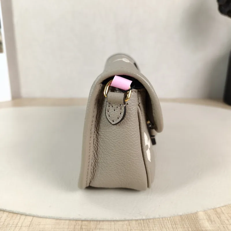 Louis Vuitton Crossbody Bag Diane Baguette Bag Empreinte Embossed Calfskin nano 19 × 6 × 10.5 cm — detail view 12 of 12