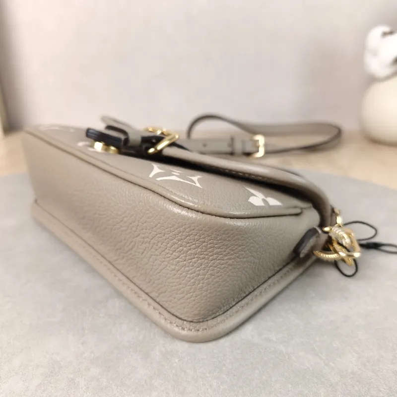 Louis Vuitton Crossbody Bag Diane Baguette Bag Empreinte Embossed Calfskin nano 19 × 6 × 10.5 cm — detail view 3 of 14