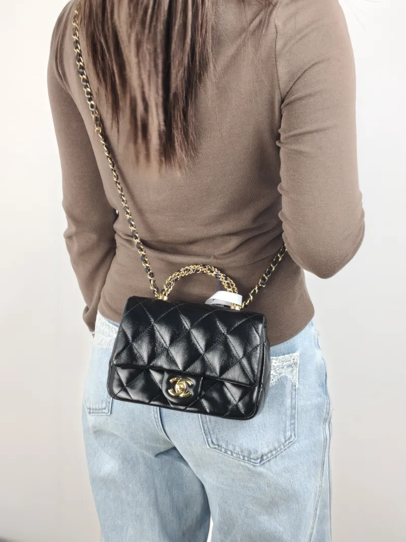 Chanel Crossbody Bag 24b Black Waxed Leather One Size 19 × 6 × 13 cm — on-model view 2 of 3