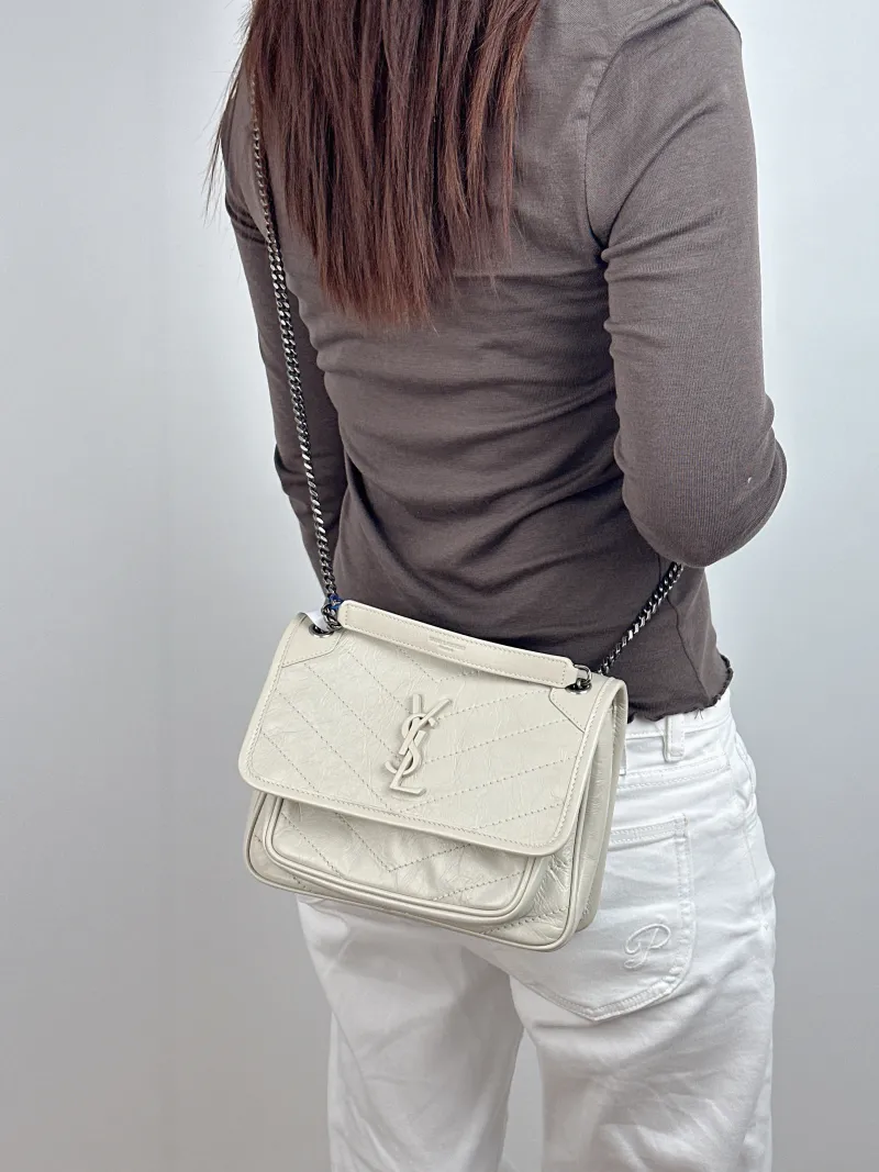 SAINT LAURENT Crossbody Bag Niki D White Waxed Leather Small 21 × 7.5 × 16 cm — on-model view 1 of 2