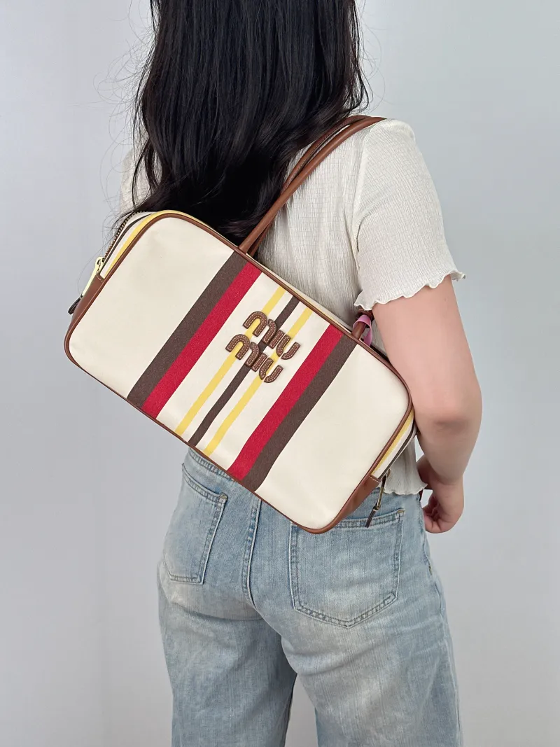 Miumiu Top Handle Bag Beau Colorblock Canvas · Calfskin Large 34 × 10 × 23 cm — on-model view 1 of 2