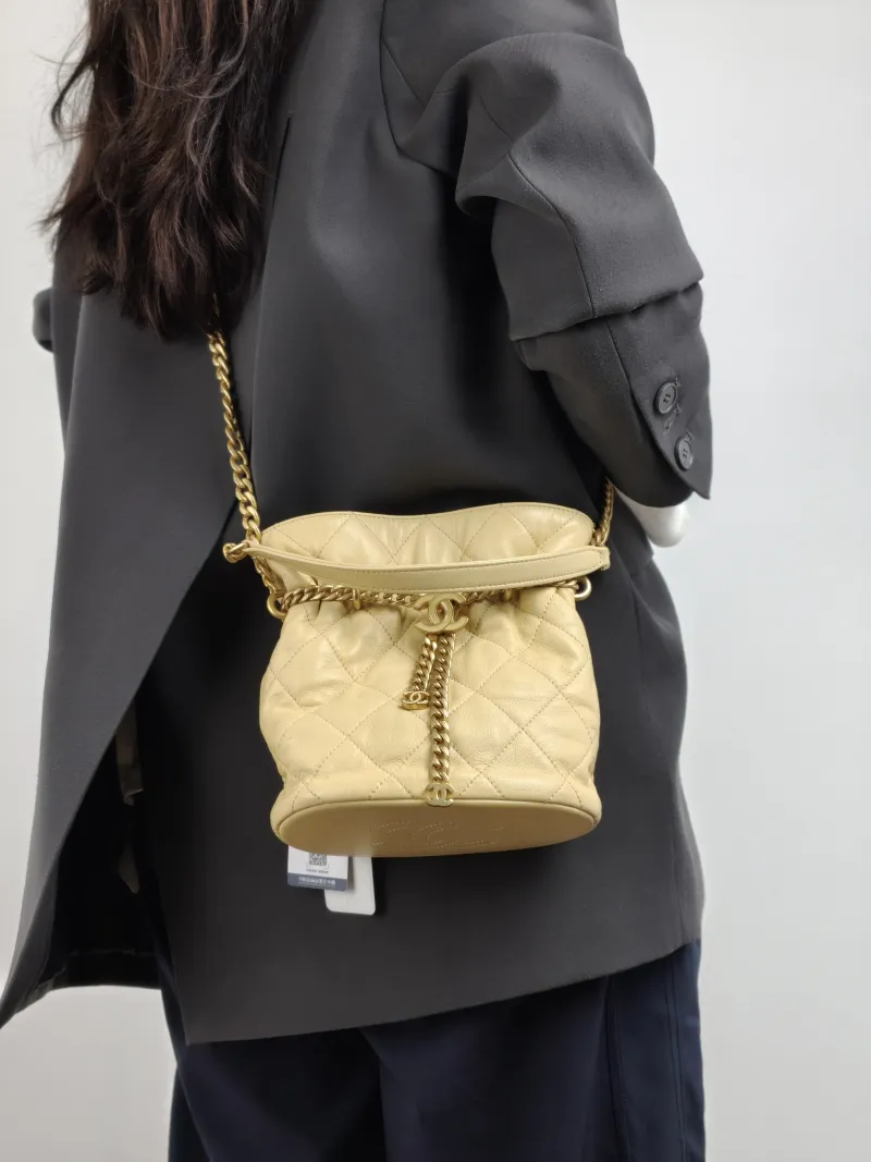 Chanel Shoulder Bag Bucket Bag Yellow Lambskin One Size 17 × 10 × 18.5 cm — on-model view 1 of 2