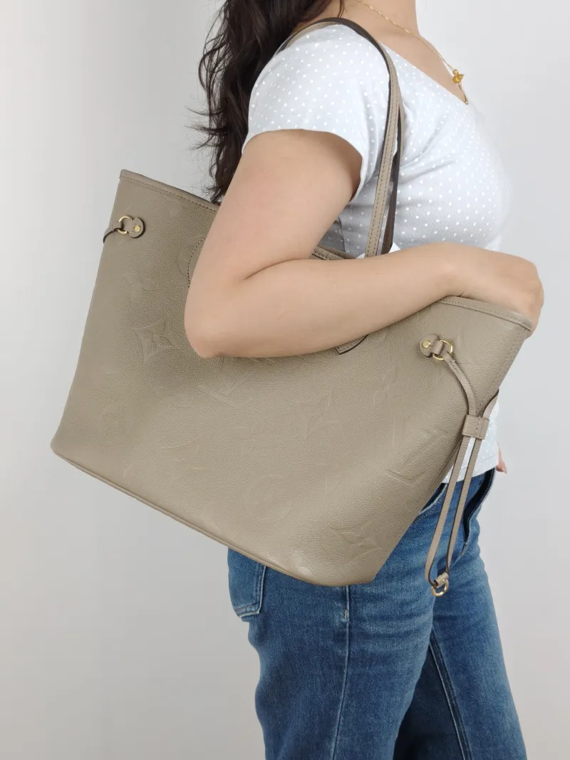Louis Vuitton Shoulder Bag Neverfull Empreinte Embossed Calfskin Medium 31 × 14 × 28 cm — on-model view 1 of 2