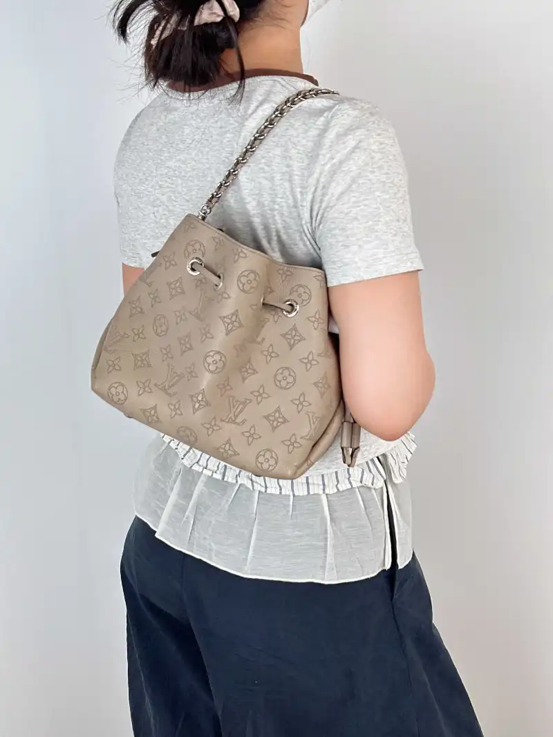 Louis Vuitton Crossbody Bag BELLA Calfskin One Size 22 × 14 × 19 cm — on-model view 1 of 3