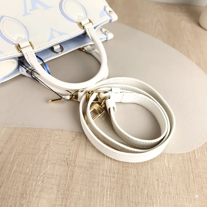 Louis Vuitton Shoulder Bag Onthego White · Blue Monogram Empreinte Embossed Calfskin Small 25 × 11.5 × 19 cm — detail view 7 of 11