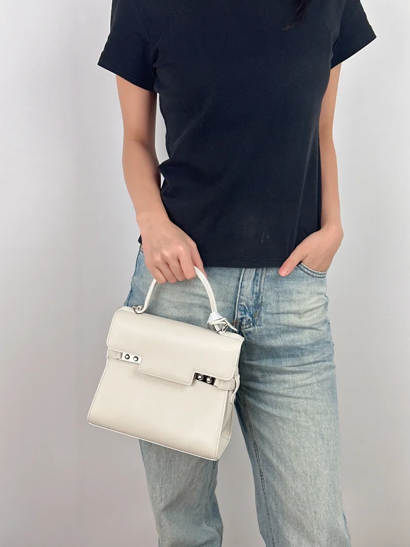 DELVAUX Top Handle Bag Tempete Top Handle Bag White Calfskin Small 21.5 × 8.5 × 19.5 cm — on-model view 2 of 3