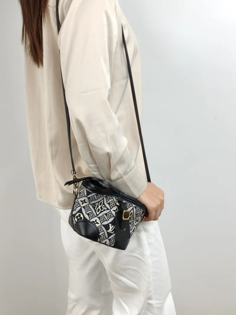 Louis Vuitton Crossbody Bag NOÉ PURSE 1854 Mini 11.5 × 11.5 × 12 cm — on-model view 1 of 2