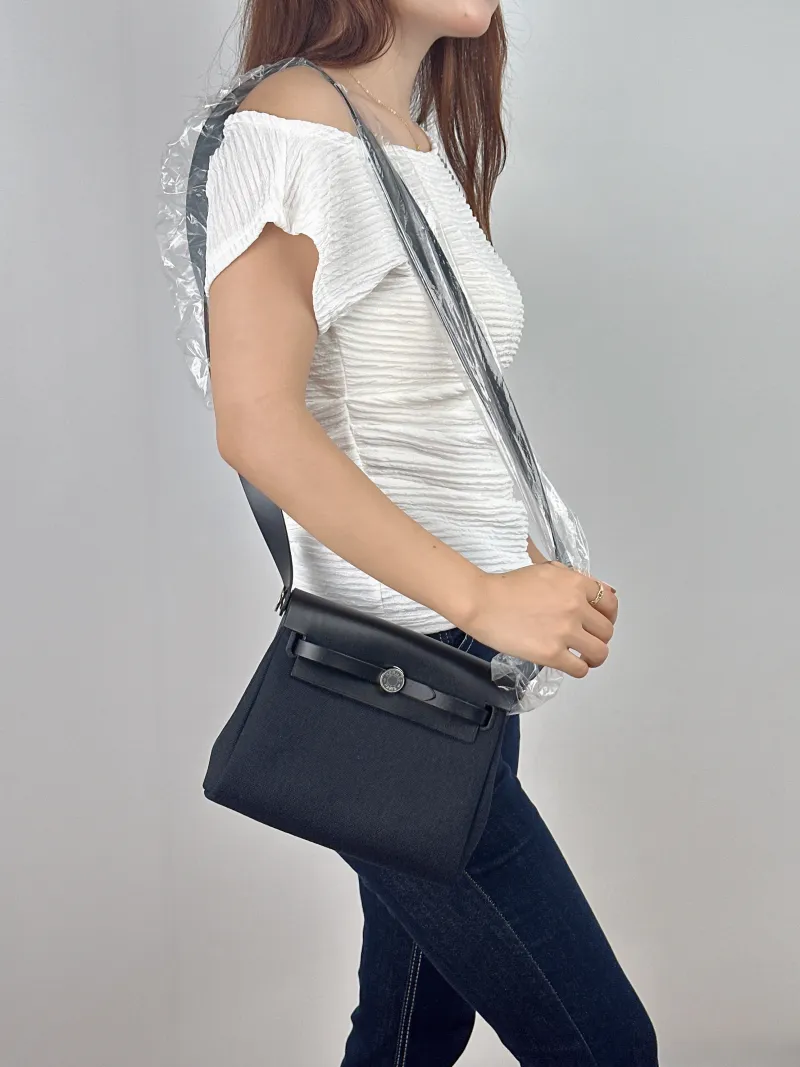 Hermès Crossbody Bag Herbag Zip 20 Black Canvas Mini 20.5 × 7 × 16.5 cm G — on-model view 2 of 2