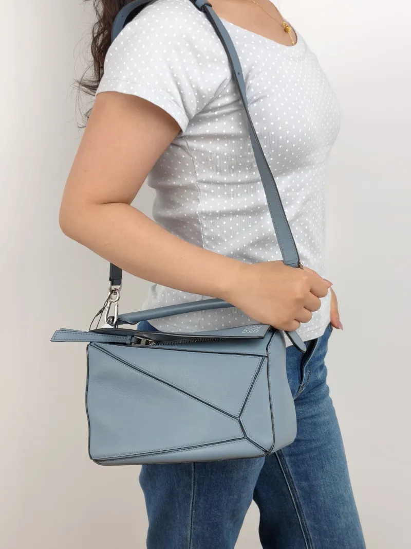 LOEWE Crossbody Bag Puzzle Blue CC alfskin Small 24 × 10.5 × 16.5 cm — on-model view 1 of 2