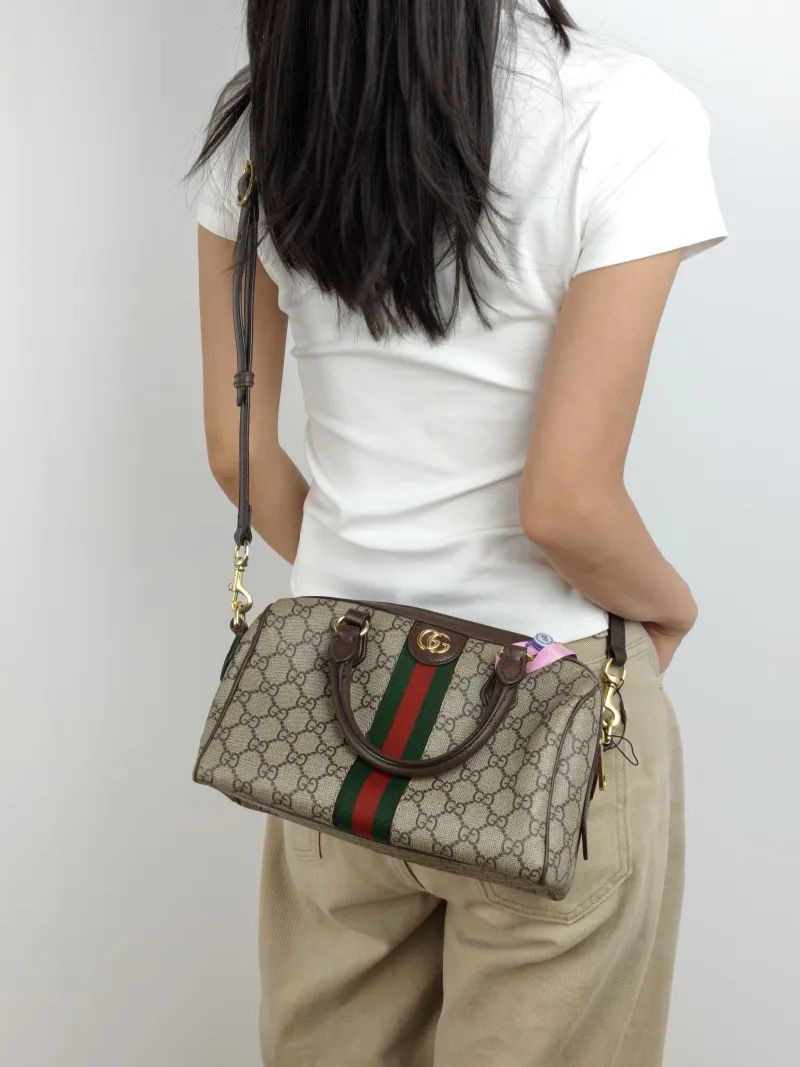 GUCCI Top Handle Bag Ophidia Monogram PVC Medium 25 × 14 × 17 cm — on-model view 2 of 3
