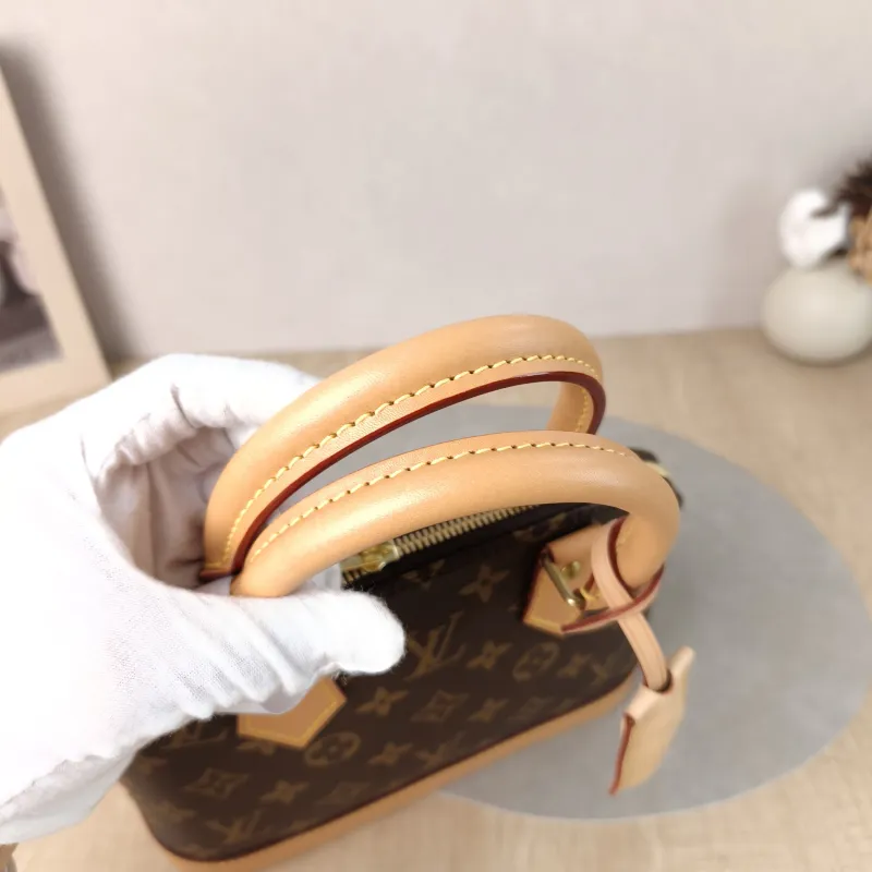 Louis Vuitton Crossbody Bag Alma BB Monogram PVC BB 23.5 × 11.5 × 17.5 cm — detail view 2 of 12