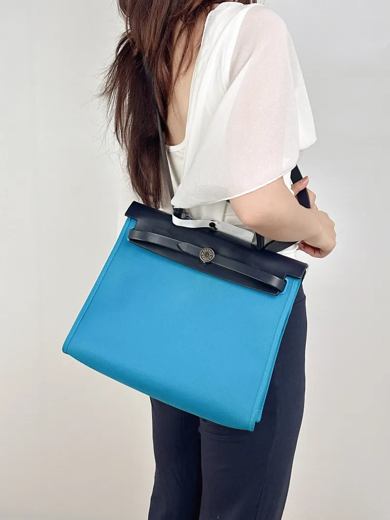 Hermès Crossbody Bag Herbag 31B3 Canvas Medium30.5 × 11 × 25.5 cm — on-model view 2 of 2