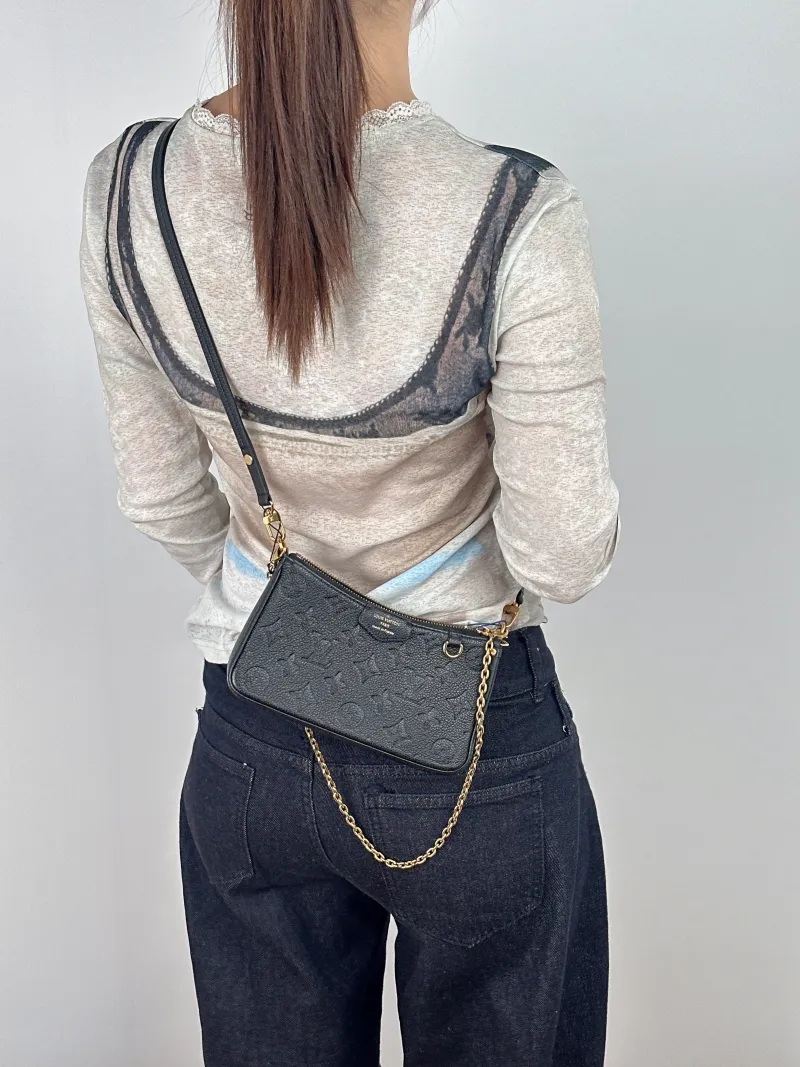 Louis Vuitton Crossbody Bag EASY POUCH ON STRAP Black Empreinte Embossed Calfskinmini19 × 3 × 11.5 cm — on-model view 1 of 2
