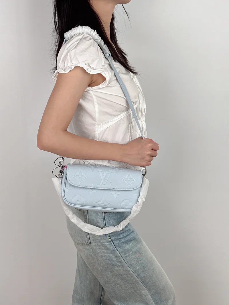 Louis Vuitton Crossbody Bag IVY Blue Empreinte Embossed Calfskin Small 23.5 × 4.3 × 12 cm — on-model view 1 of 3