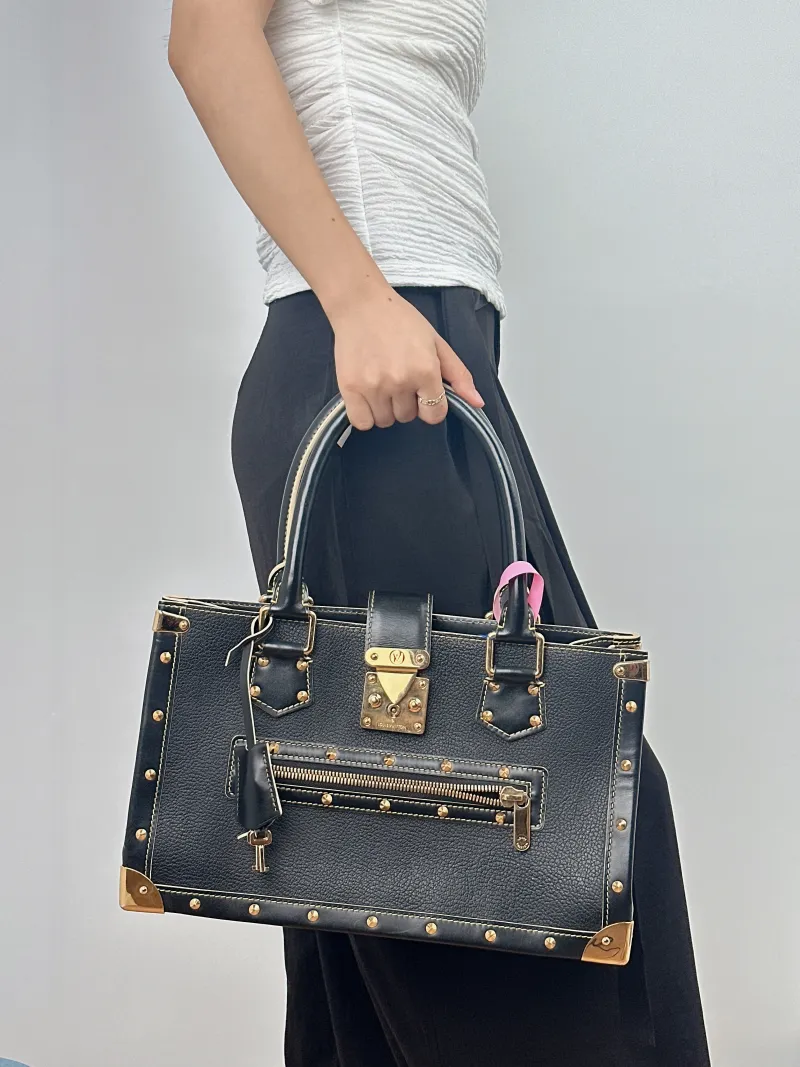 Louis Vuitton Top Handle Bag Suhali Vintage Black Calfskin One Size 36 × 12 × 22 cm — on-model view 1 of 2