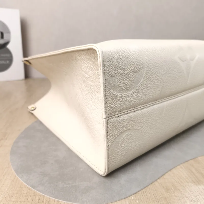 Louis Vuitton Shoulder Bag Onthego Medium White Monogram Empreinte Embossed Calfskin Medium 35 × 14 × 27 cm — detail view 8 of 12