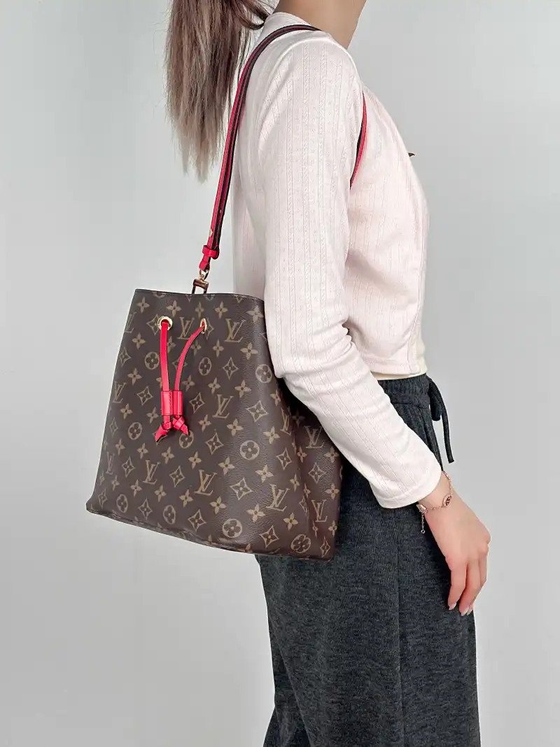 Louis Vuitton Shoulder Bag NÉONOÉ Bucket Bag PVC Medium 26 × 17.5 × 26 cm — on-model view 1 of 2