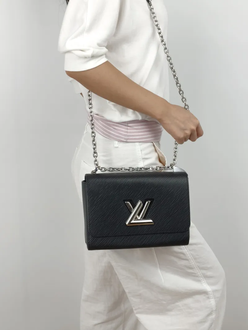 Louis Vuitton Crossbody Bag Twist Black Epi Embossed Calfskin Medium 23 × 9.5 × 17 cm — on-model view 1 of 3
