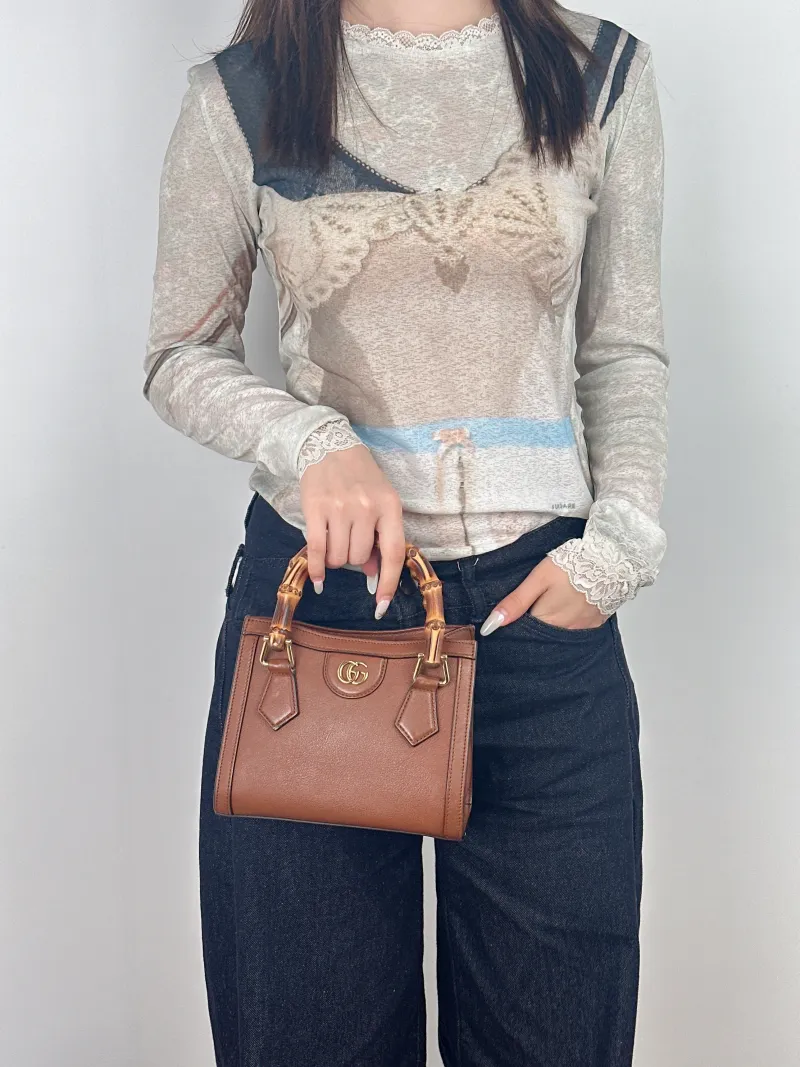 GUCCI Top Handle Bag Diana Top Handle Bag Caramel Calfskin Small 20 × 10 × 16 cm — on-model view 1 of 2