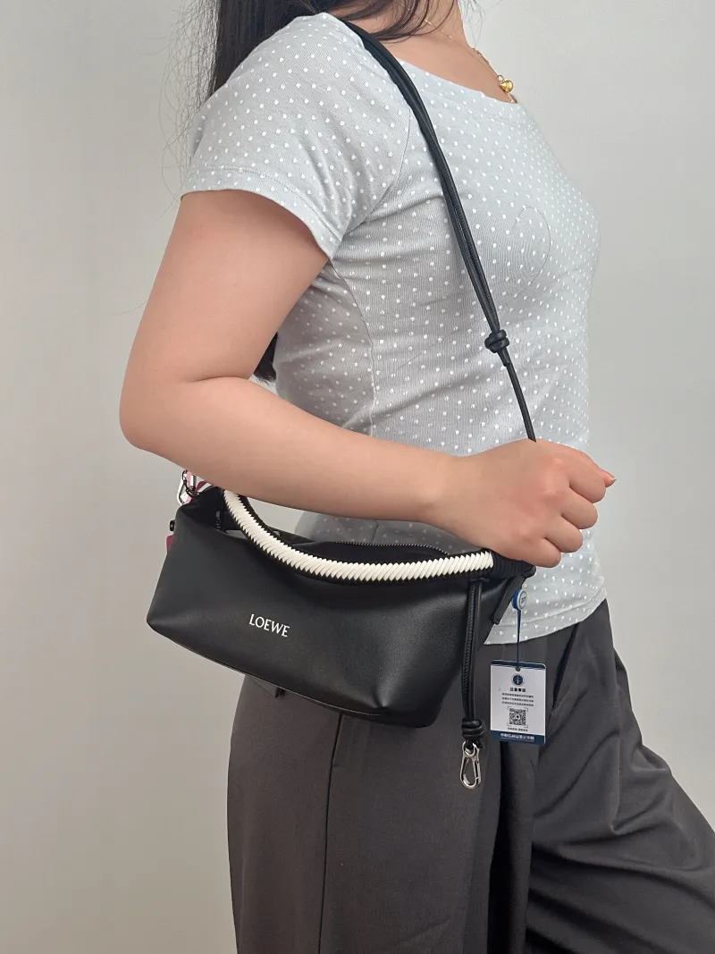 LOEWE Shoulder Bag Cala Woven Black White Lambskin Mini 26 × 10 × 13 cm — on-model view 2 of 3